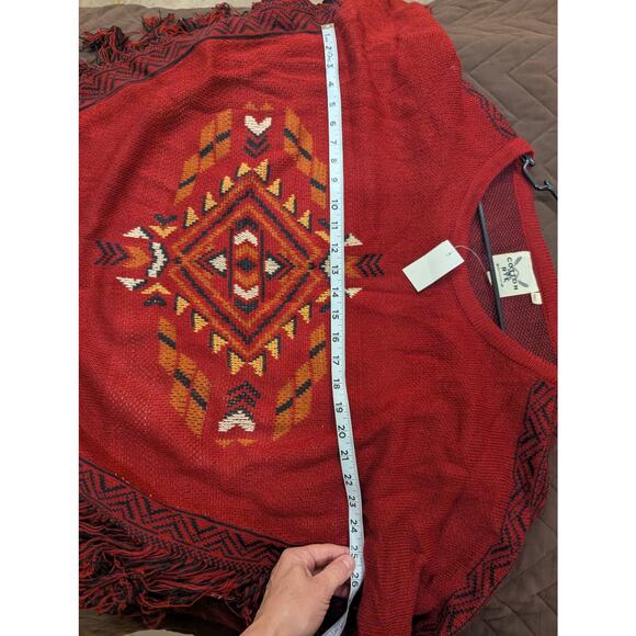 Southwestern style rust colored sweater with fringe detailing by Cotton & Rye - Picture 4 of 8
